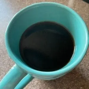 freshly brewed k cup pod in mug